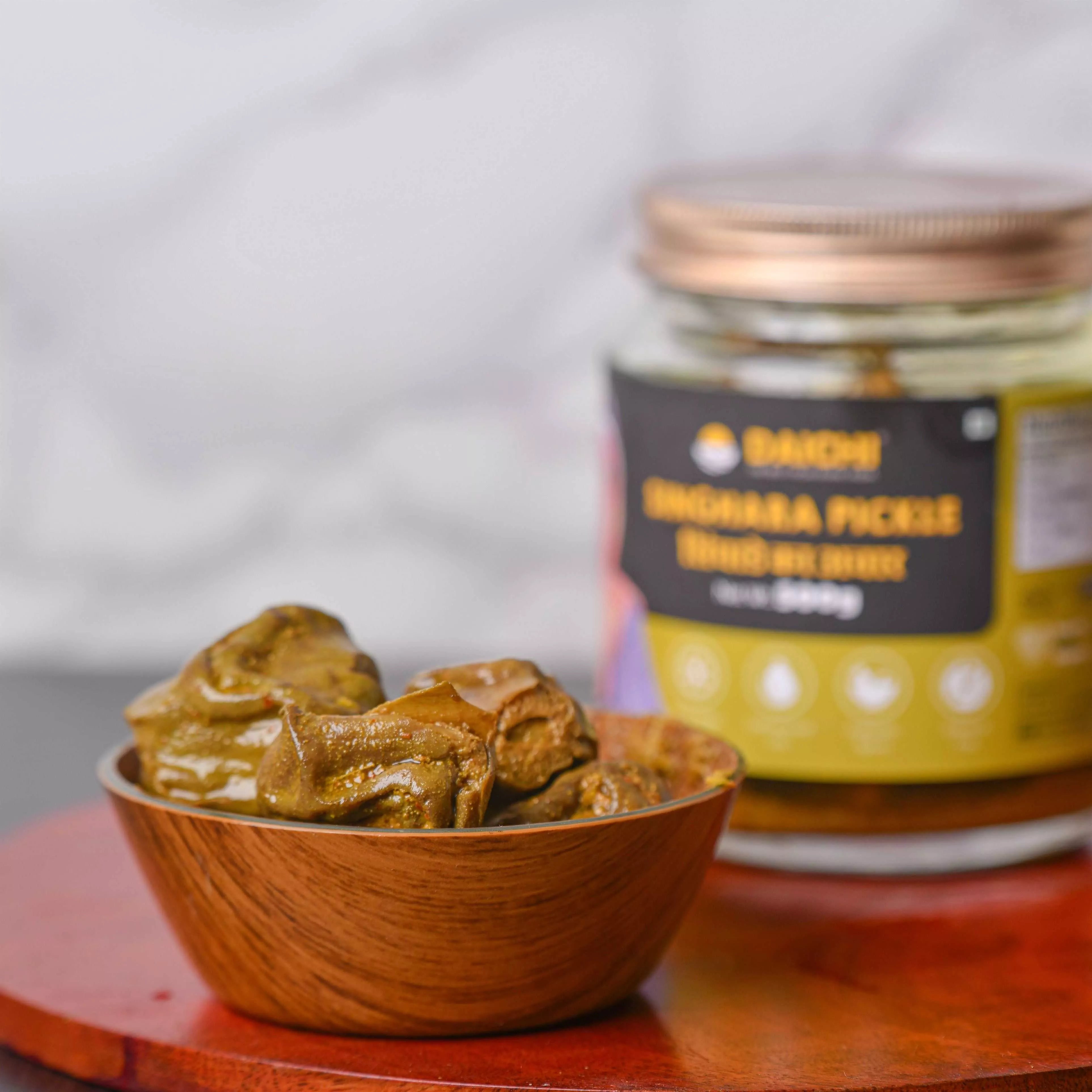 Daichi Singhara Pickle | Crafted with Love by Women Artisans | Sun Cured | Cold-Pressed Mustard Oil | In-House Spices Daichi Singhara Pickle | Crafted with Love by Women Artisans | Sun Cured | Cold-Pressed Mustard Oil | In-House Spices