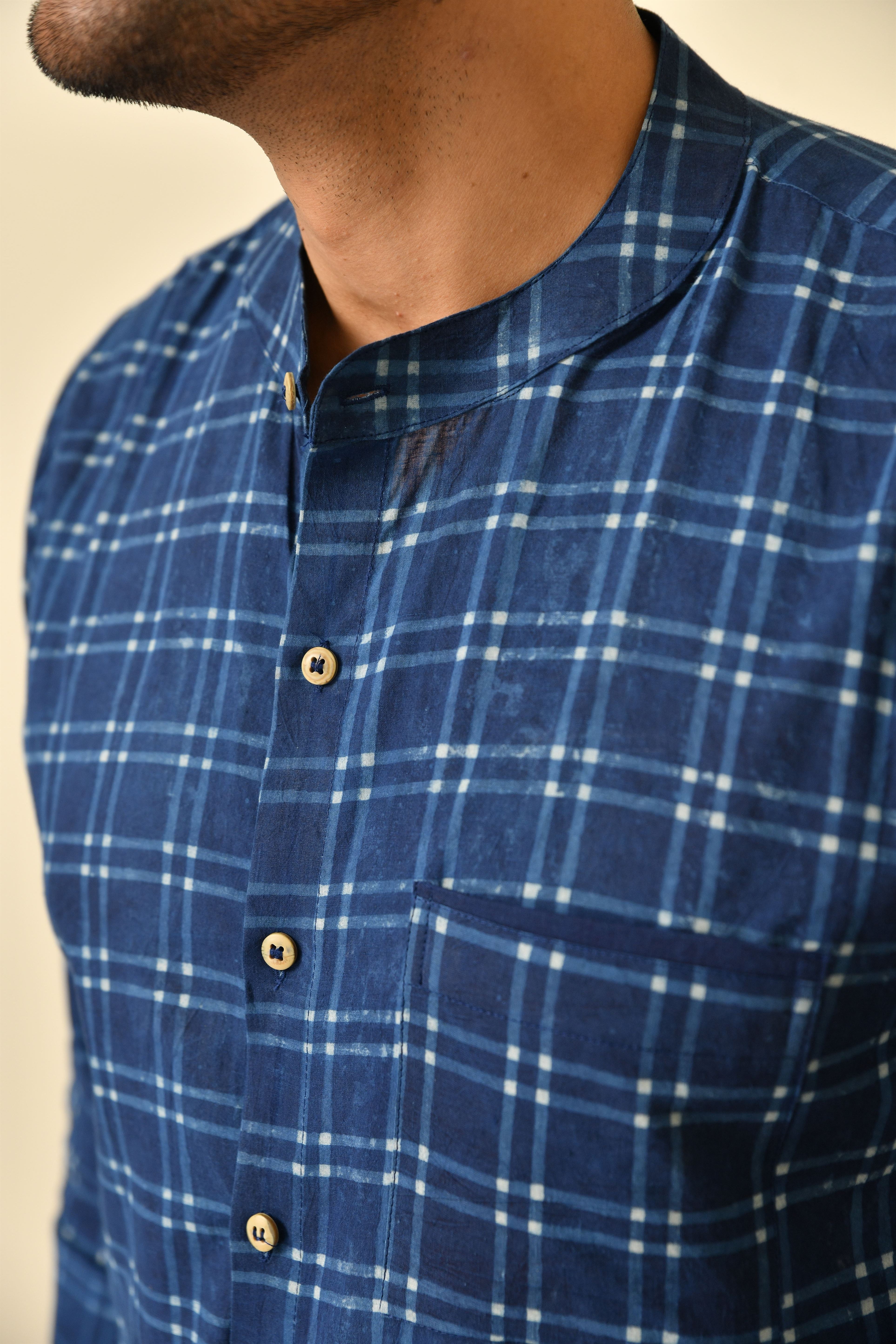 Mandarin collar full sleeves shirt in natural Bagru print with pocket and wooden buttons.