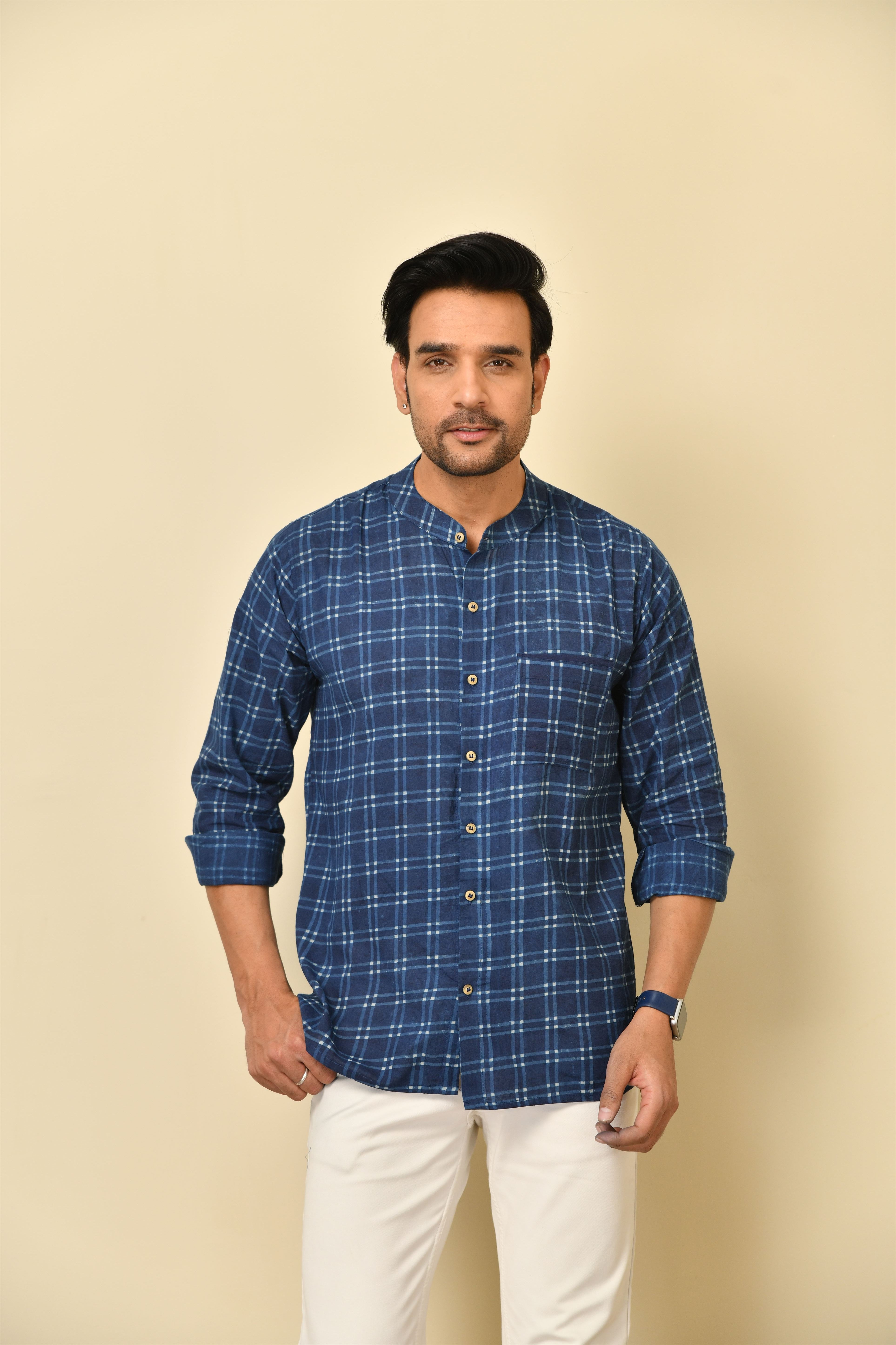 Mandarin collar full sleeves shirt in natural Bagru print with pocket and wooden buttons.