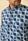 Mandarin collar short kurta in natural Bagru print with wooden buttons.