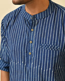 Mandarin collar full sleeves shirt in natural Bagru print with welt pocket and wooden buttons.