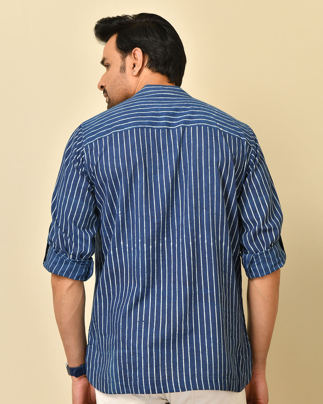 Mandarin collar full sleeves shirt in natural Bagru print with welt pocket and wooden buttons.